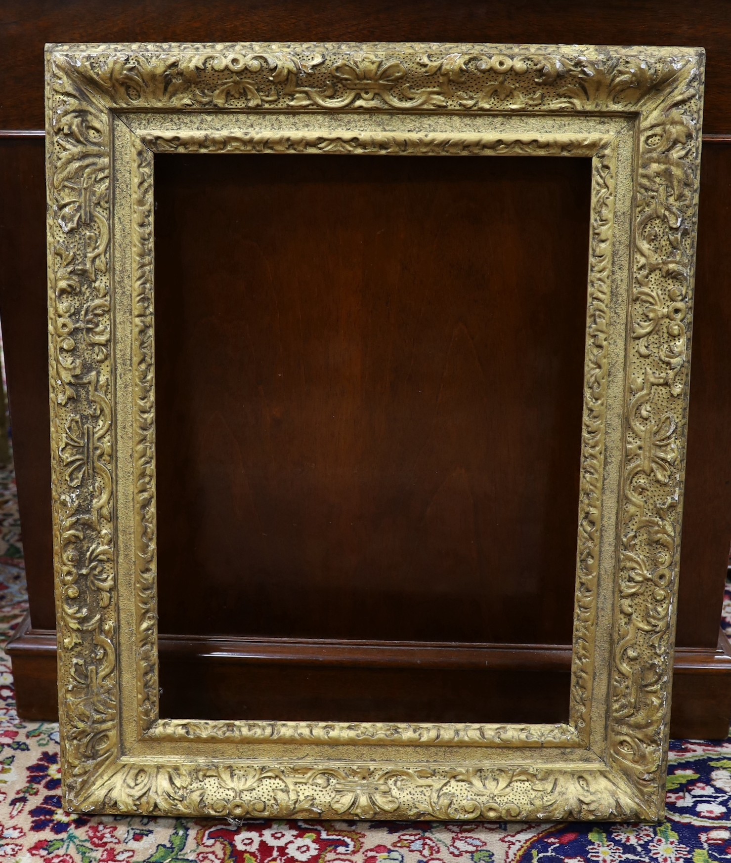 An 18th century French gilt carved wood picture frame, the aperture 51 x 38cm
